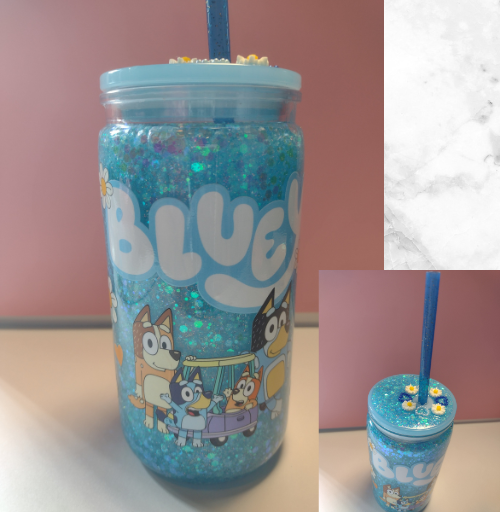 Blue glitter custom snow globe tumbler featuring a Bluey character design with floating sparkle and matching lid, handmade drinkware