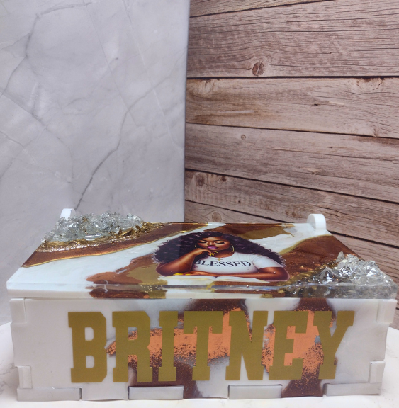 Decorative box with a portrait and 'Blessed' text, featuring the name 'Britney', against a marble and resin background.