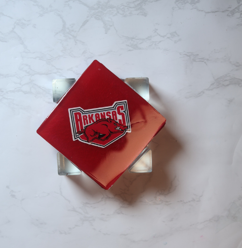 Custom red resin coaster set with four coasters and matching holder featuring sports team designs