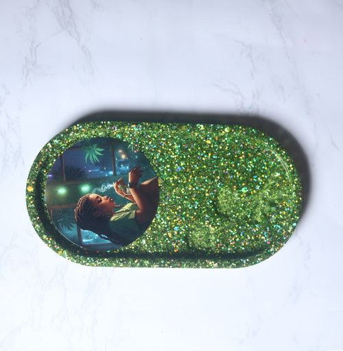 Small handmade oval resin tray with glitter finish used for decorative storage